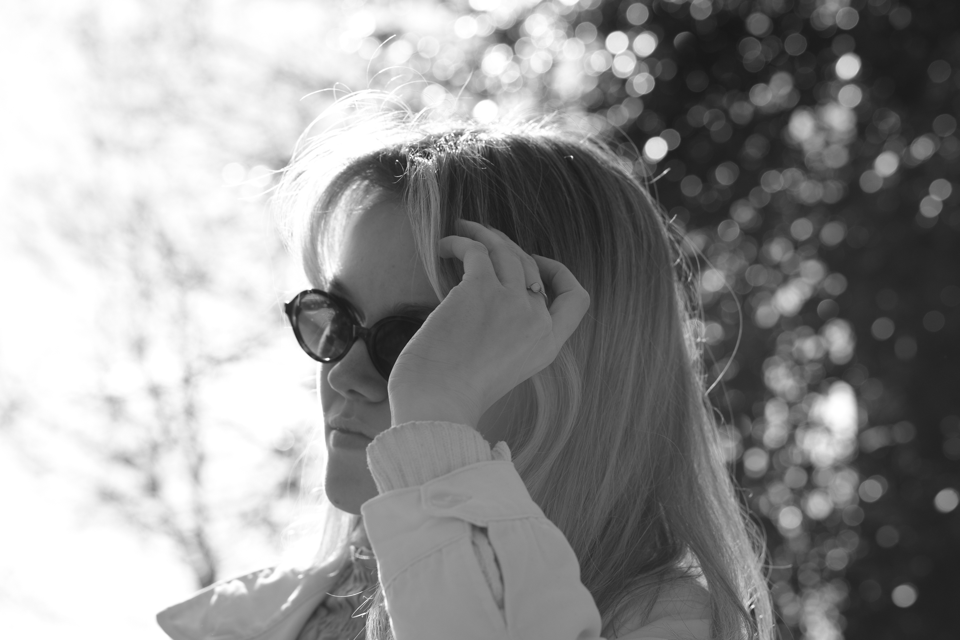 Woman in sunglasses, black and white profile