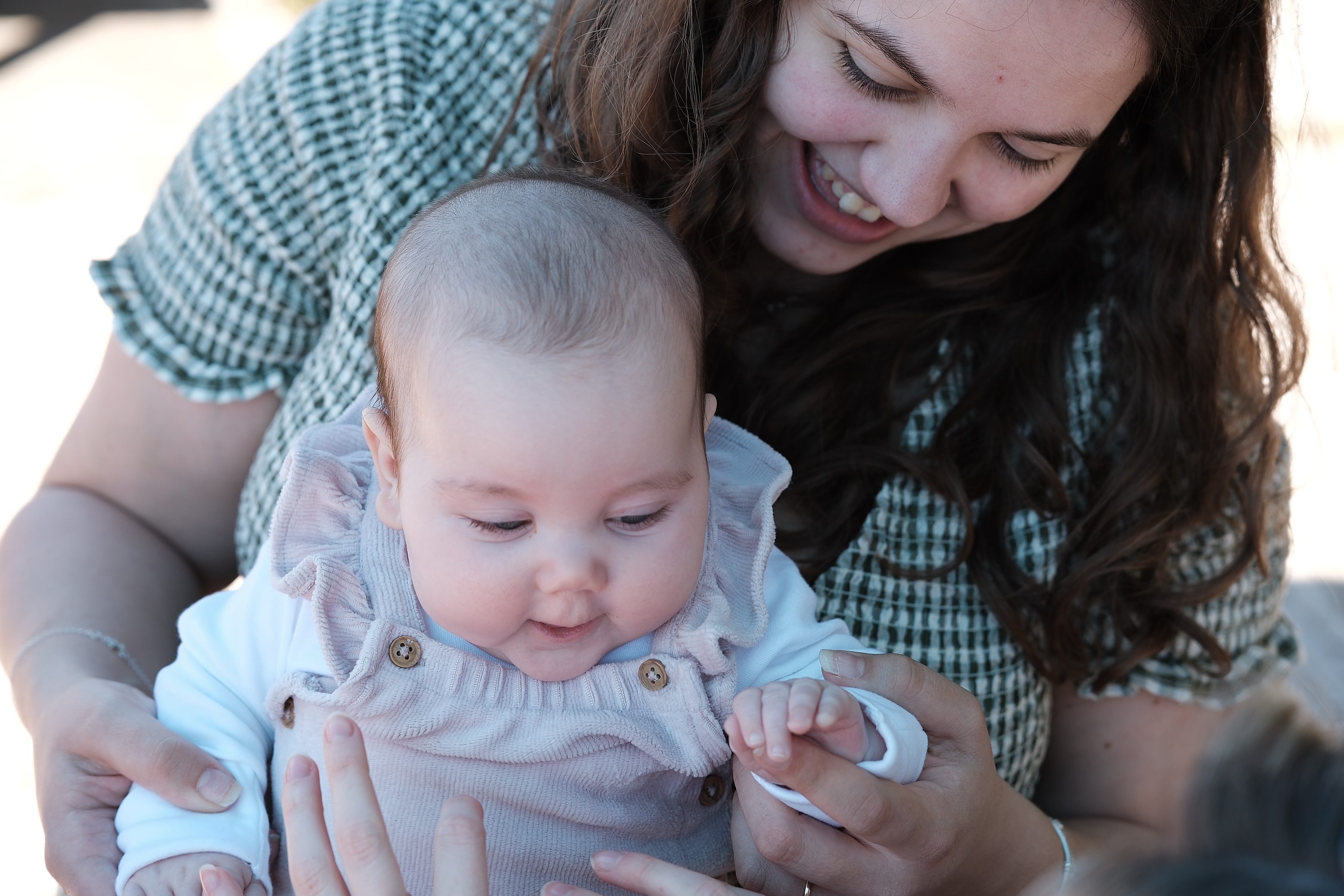 Mother holding baby close