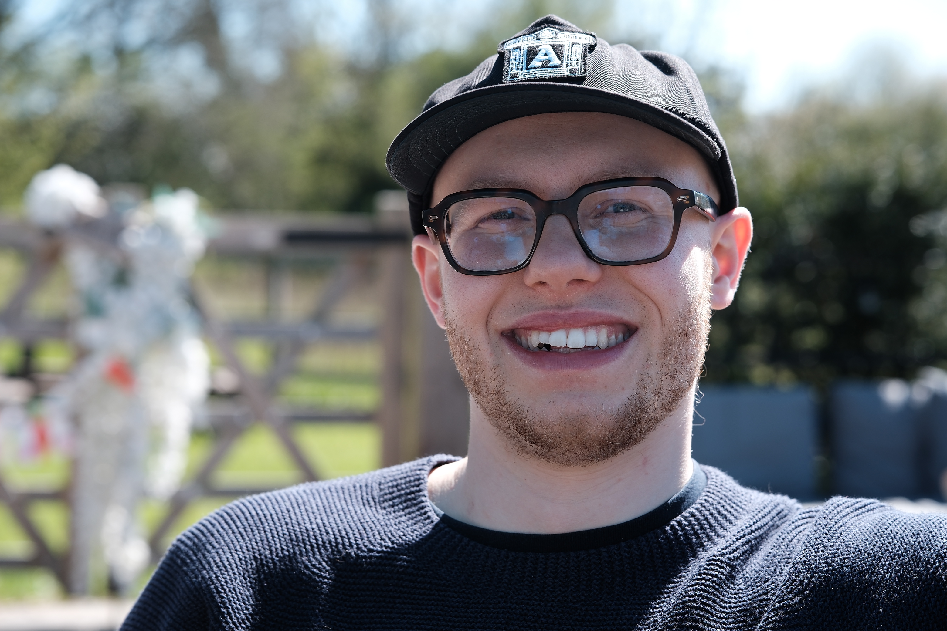 Oliver Rodwell portrait by a gate